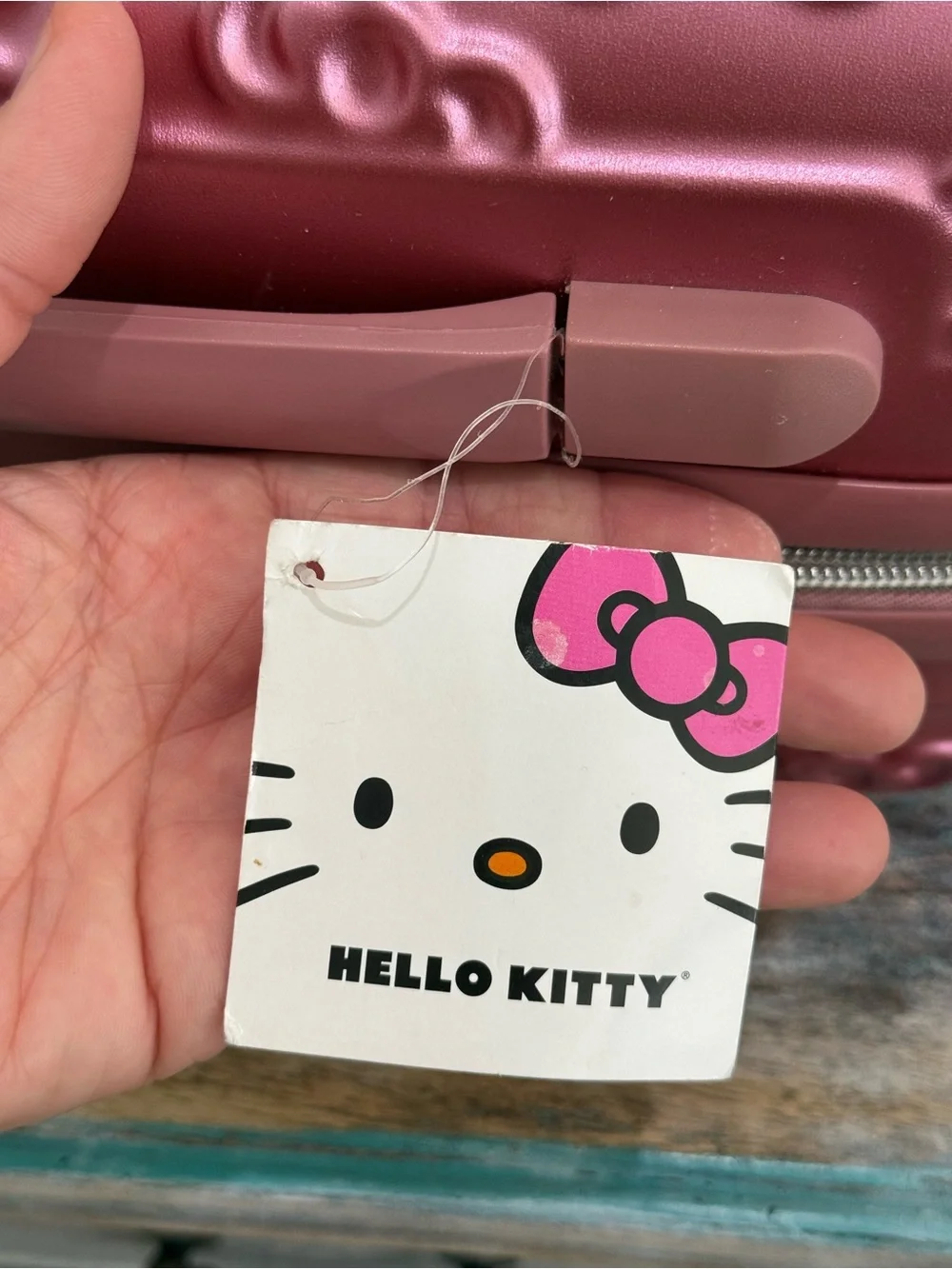 NWT FŪL Hello Kitty 13” Metallic Pink Hardshell Suitcase w/Logo Design